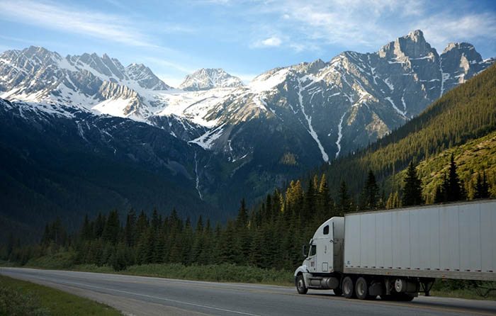 truck driving through mountain road